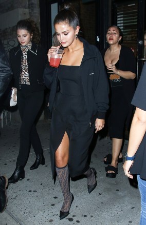 Selena Gomez is seen wearing a black slit dress and sipping a pink drink in New York City, NY.Pictured: Selena GomezRef: SPL5022314 080918 NON-EXCLUSIVEPicture by: Bauer-Griffin / SplashNews.comSplash News and PicturesLos Angeles: 310-821-2666New York: 212-619-2666London: 0207 644 7656Milan: +39 02 4399 8577Sydney: +61 02 9240 7700photodesk@splashnews.comWorld Rights