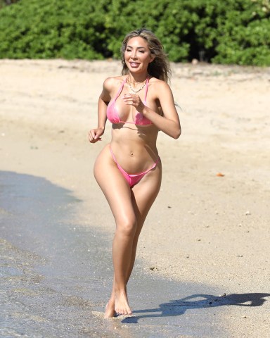 Honolulu, HI  - *EXCLUSIVE*  - Farrah Abraham shows off her curves during a birthday vacation to Hawaii.  The Teen Mom looked great in a tiny bikini as she frolicked in the ocean.Pictured: Farrah AbrahamBACKGRID USA 5 JUNE 2022 BYLINE MUST READ: BACKGRIDUSA: +1 310 798 9111 / usasales@backgrid.comUK: +44 208 344 2007 / uksales@backgrid.com*UK Clients - Pictures Containing ChildrenPlease Pixelate Face Prior To Publication*