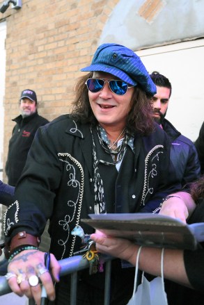 Johnny Depp has a big smile while signing autographs and posing for selfies for fans outside the Capital Theater in Westchester, NY. Depp is currently on tour.Photo: Johnny Depp Ref: SPL5492036 081022 Non-Exclusive Photo Credit: Elder Ordonez / SplashNews.com Splash News and Photos USA: +1 310-525-5808 London: +44 (0)20 8126 1009 Berlin: +49 175 3764 166 photodesk@splashnews.com World rights, no Polish rights, no Portuguese rights, no Russian rights