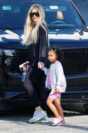 los angeles, CA - *EXCLUSIVE* - Khloe Kardashian steps out with her daughter True Thompson after she throws shade at her brother Rob's ex Blac Chyna after the model moaned about selling three cars due to 