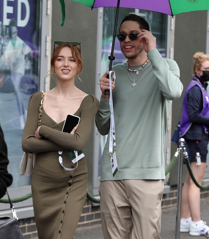 Phoebe Dynevor and boyfriend Pete Davidson look happy as they arrive at the Wimbledon tennis tournament