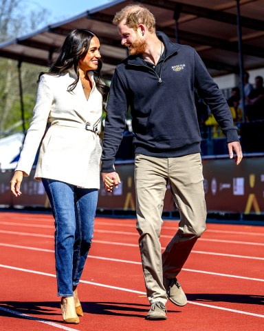 Prince Harry and his wife Meghan Duchess of Sussex, during the athletics section of the fifth edition of the Invictus Games, an international sporting event for servicemen and veterans who have been psychologically or physically injured during their military service 5th edition of the Invictus Games, The Invictus Games Stadium, Zuiderpark, The Hague, The Netherlands - 17 Apr 2022