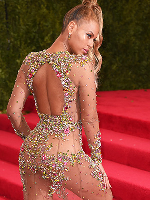 Beyonce keeps her Met Gala ponytail as she goes from red 