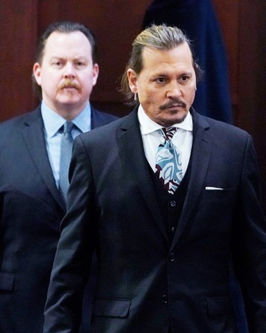 Actor Johnny Depp walks into the courtroom after a break at the Fairfax County Circuit Courthouse in Fairfax, Virginia, USA, 18 April 2022. Johnny Depp's 50 million US dollars defamation lawsuit against Amber Heard that started on 10 April is expected to last five or six weeks. Depp v Heard defamation lawsuit at the Fairfax County Circuit Court, USA - 18 Apr 2022