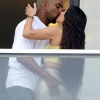 Kanye West and Kim Kardashian pack on the PDA at their new condo in Miami