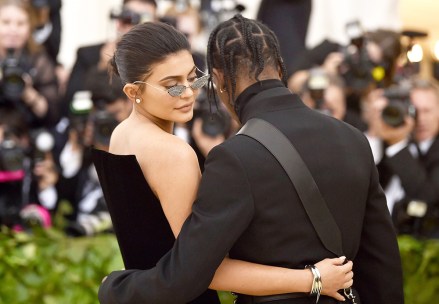 Kylie Jenner, Travis Scott. Kylie Jenner, left and Travis Scott attend The Metropolitan Museum of Art's Costume Institute benefit gala celebrating the opening of the Heavenly Bodies: Fashion and the Catholic Imagination exhibition, in New York
2018 MET Museum Costume Institute Benefit Gala, New York, USA - 07 May 2018