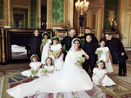 In this photo released by Kensington Palace, shows an official wedding photo of Britain's Prince Harry and Meghan Markle, center, in Windsor Castle, Windsor, England, Saturday May 19, 2018. Others in photo from left, back row, Brian Mulroney, Remi Litt, Rylan Litt, Jasper Dyer, Prince George, Ivy Mulroney, John Mulroney; front row, Zalie Warren, Princess Charlotte, Florence van Cutsem
Britain Royal Wedding, Windsor, United Kingdom - 21 May 2018