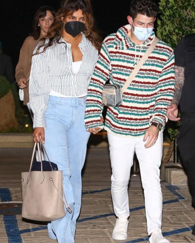 Malibu, CA  - Nick Jonas and a fresh-faced Priyanka Chopra were seen leaving after a romantic Sunday dinner at Nobu restaurant in Malibu.Priyanka gave fans a glimpse of her romantic Sunday drive with a mushy picture on Instagram. The actress posted a picture of holding Nick’s hand which enjoying a drive. She captioned it as “My favorite kind of Sunday” and added a mushy note with a red heart emoji. The newbie parents seem to be enjoying some downtime.Pictured: Nick Jonas, Priyanka ChopraBACKGRID USA 20 FEBRUARY 2022 USA: +1 310 798 9111 / usasales@backgrid.comUK: +44 208 344 2007 / uksales@backgrid.com*UK Clients - Pictures Containing ChildrenPlease Pixelate Face Prior To Publication*