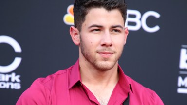 Nick Jonas wearing one suspender strap at the 2018 Billboard Music Awards