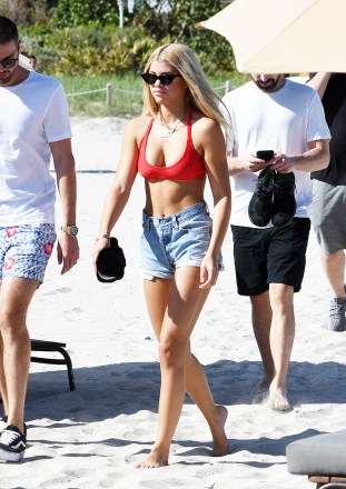 December 6, 2017: Sofia Richie wears a red bikini as she hits the beach with boyfriend Scott Disick in Miami Beach, Florida. 06 Dec 2017 Pictured: Sofia Richie; Scott Disick. Photo credit: MEGA TheMegaAgency.com +1 888 505 6342 (Mega Agency TagID: MEGA128871_009.jpg) [Photo via Mega Agency]