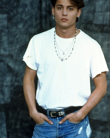 Editorial use only Mandatory Credit: Photo by Snap/Shutterstock (390862cw) FILM STILLS OF '21 JUMP STREET - TV' WITH 1989, CLOTHING, JOHNNY DEPP, JEANS, TEE SHIRT, REBEL, TOUGH GUY, T-SHIRT - WHITE, CHAINS, CRUCIFIX, TORN, RIPPED, HANDS IN POCKETS, BELT, ADAMS APPLE, PORTRAIT, STUDIO, T-SHIRT IN 1989 VARIOUS FILM STILLS