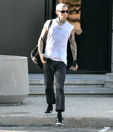 EXCLUSIVE: Travis Barker was spotted looking cool once again and for the third time after his recent medical emergency and hospital stay. The Rocker and Blink 182 band member was spotted leaving a recording studio in Los Angeles, CA. 06 Jul 2022 Pictured: Travis Barker. Photo credit: @CelebCandidly / MEGA TheMegaAgency.com +1 888 505 6342 (Mega Agency TagID: MEGA875552_013.jpg) [Photo via Mega Agency]
