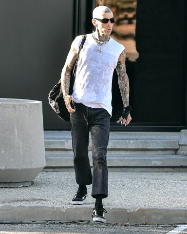 EXCLUSIVE: Travis Barker was spotted looking cool once again and for the third time after his recent medical emergency and hospital stay. The Rocker and Blink 182 band member was spotted leaving a recording studio in Los Angeles, CA. 06 Jul 2022 Pictured: Travis Barker. Photo credit: @CelebCandidly / MEGA TheMegaAgency.com +1 888 505 6342 (Mega Agency TagID: MEGA875552_013.jpg) [Photo via Mega Agency]