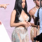 EXCLUSIVE: Cardi B. wears a very reveling rhinestone bikini, similar to one worn by rival Nikki Minaj, as she films a music video in Miami