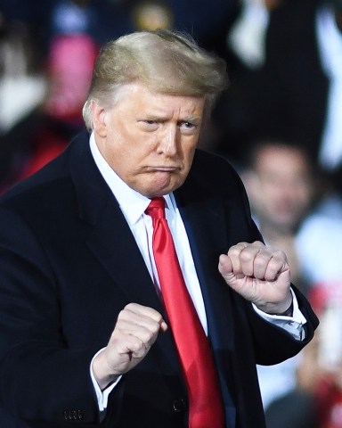 U.S. President Donald Trump dances after speaking at a Republican National Committee Victory Rally in support of incumbent Republican Senate candidates Sen. Kelly Loeffler (R-GA) and Sen. David Perdue (R-GA) at the Dalton Regional Airport.
Trump Campaigns for Georgia Senate Candidates in Dalton, USA - 4 Jan 2021