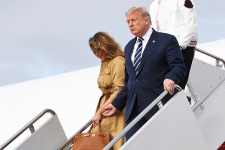 President Donald Trump and first lady Melania Trump walk down the steps of Air Force One at Andrews Air Force Base, Md., Sunday, Aug. 16, 2020. Trump was returning to Washington after spending the weekend at Trump National Golf Club in New Jersey. (AP Photo/Susan Walsh)