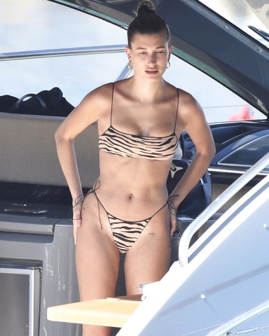 Sardinia, ITALY  - Hailey Baldwin and Bella Hadid throw on their bikinis and have some lunch while relaxing on a yacht in Sardinia. Hailey rocked a leopard print bikini while Bella sported a orange bikini.Pictured: Hailey BaldwinBACKGRID USA 23 JUNE 2020 BYLINE MUST READ: CIAOPIX / FREZZA LAFATA / BACKGRIDUSA: +1 310 798 9111 / usasales@backgrid.comUK: +44 208 344 2007 / uksales@backgrid.com*UK Clients - Pictures Containing ChildrenPlease Pixelate Face Prior To Publication*