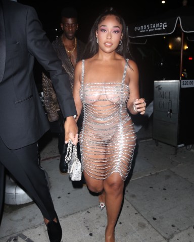 West Hollywood, CA  - Jordyn Woods looks stunning in a revealing jewel chain dress as she celebrates her birthday with boyfriend Karl Anthony Towns at The Nice Guy in West Hollywood.  Pictured: Jordyn Woods, Karl Anthony Towns  BACKGRID USA 18 SEPTEMBER 2021   USA: +1 310 798 9111 / usasales@backgrid.com  UK: +44 208 344 2007 / uksales@backgrid.com  *UK Clients - Pictures Containing Children Please Pixelate Face Prior To Publication*