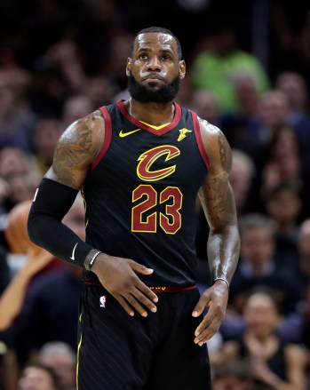 Cleveland Cavaliers' LeBron James looks up at the scoreboard during the first half against the Golden State Warriors in Game 3 of basketball's NBA Finals, Wednesday, June 6, 2018, in Cleveland. (AP Photo/Tony Dejak)