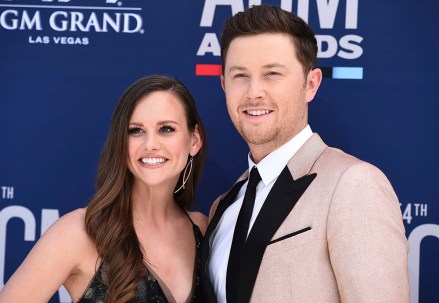 Scotty McCreery, Gabi Dugal. Scotty McCreery, right, and Gabi Dugal arrive at the 54th annual Academy of Country Music Awards at the MGM Grand Garden Arena, in Las Vegas
54th Annual Academy of Country Music Awards - Arrivals, Las Vegas, USA - 07 Apr 2019