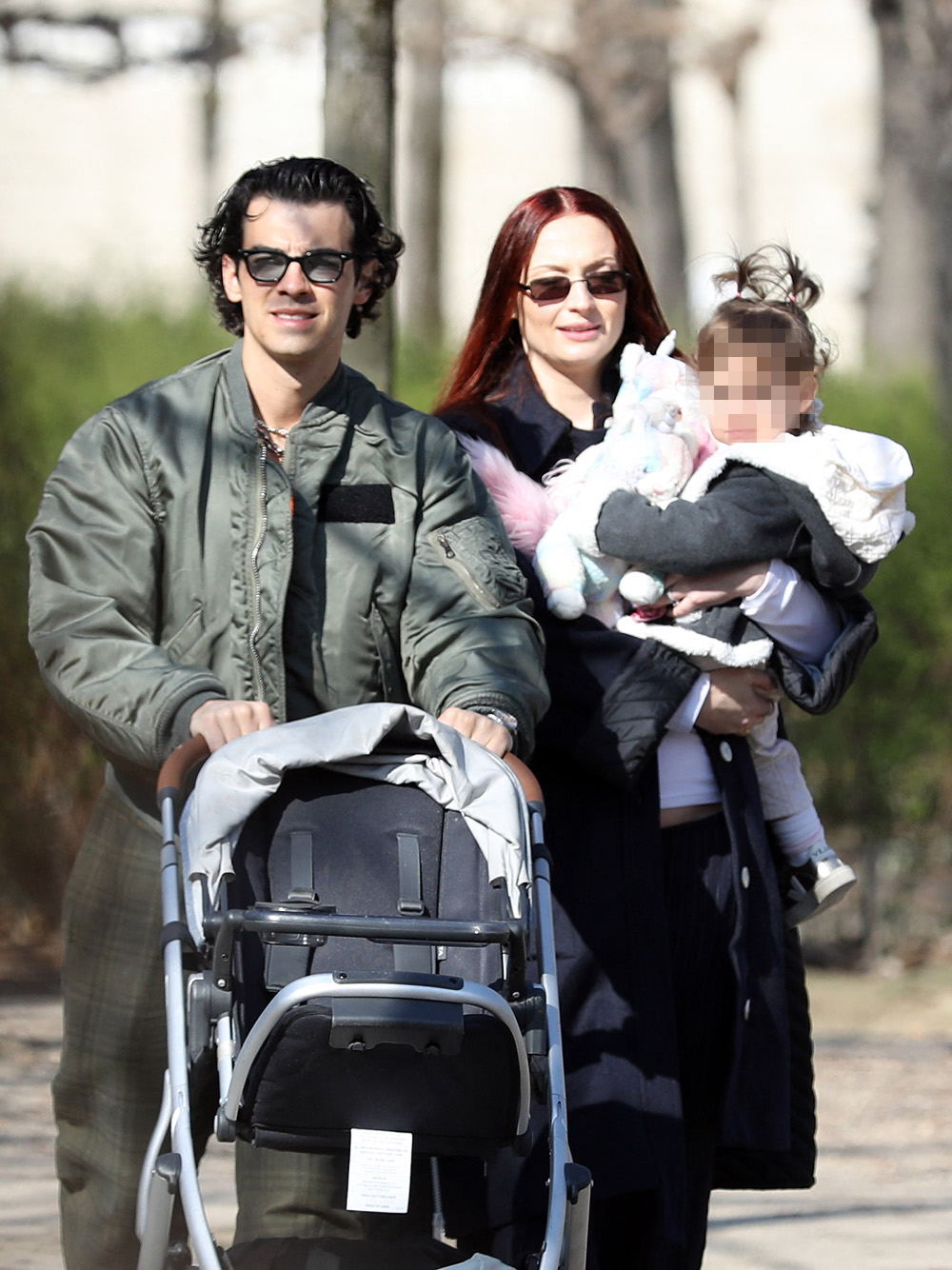 EXCLUSIVE: Sophie Turner and Joe Jonas go for a long walk with their daughter Willa in Jardin Des Tuilerie in Paris. 06 Mar 2022 Pictured: Joe Jonas and Sophie Turner. Photo credit: Love Paris/ MEGA TheMegaAgency.com +1 888 505 6342 (Mega Agency TagID: MEGA834943_001.jpg) [Photo via Mega Agency]