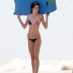 Kendall and Kylie Jenner in bikinis with Scott Disick and Kris Kardashian