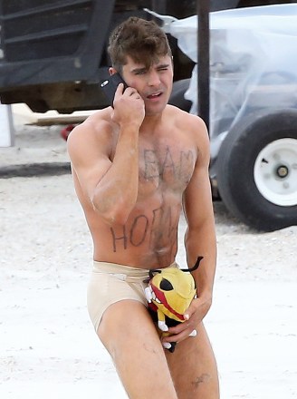 Actor Zac Efron strips down to his underwear to film a scene for his new movie 'Dirty Grandpa' in Tybee Island, Georgia.Zac's character looks to have awoken naked on the beach after a night of partying, with only a stuffed animal to "hide his shame!" The words "Team Hornet" were written on his chest too!UK RIGHTS ONLYPictured: Zac EfronRef: SPL4113654 280415 NON-EXCLUSIVEPicture by: FameFlynet.uk.com / SplashNews.comSplash News and PicturesLos Angeles: 310-821-2666New York: 212-619-2666London: 0207 644 7656Milan: +39 02 4399 8577photodesk@splashnews.comWorld Rights