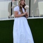 Harper Beckham is seen in her flower girl dress for her brother Brooklyn Beckham and Nicola Peltz wedding in Palm Beach