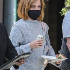 *EXCLUSIVE* Emma Watson shows off a chic new haircut as she is spotted leaving a visit to the tailor.