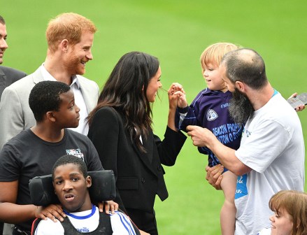 Prince Harry and Meghan Duchess of Sussex greet Walter Cullen, aged 3 during a visit to Croke Park
Prince Harry and Meghan Duchess of Sussex visit to Dublin, Ireland - 11 Jul 2018