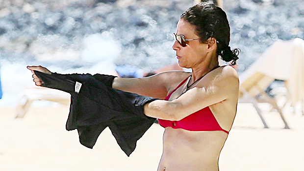 Julia Louis-Dreyfus continues to slay in a red hot bikini on her picturesqu...
