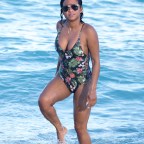 Christina Milian wears a one piece floral bikini in Miami.
