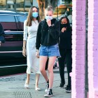 Angelina Jolie wears all white as she takes her kids Zahara and Shiloh shopping at an Ethiopian boutique in Los Angeles