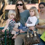 DENISE RICHARDS IN MALIBU  WITH KIDS PLAYING