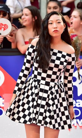 Awkwafina arrives on the red carpet at the iHeartRadio MMVAs in Toronto on Sunday, Aug. 26, 2018. (Frank Gunn/The Canadian Press via AP)