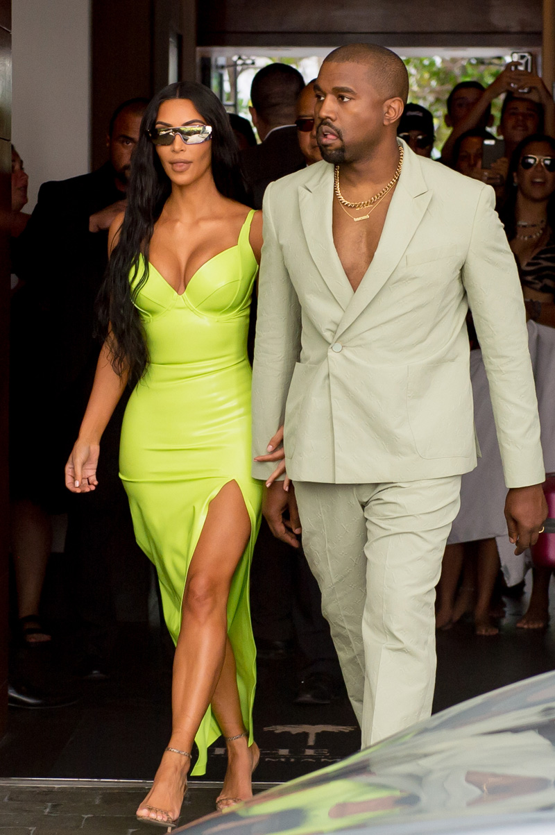 Kim Kardashian shined extra bright in neon and she and Kanye West arrive at Miami's Versace Mansion for rapper 2 Chainz's wedding on Saturday, Aug. 18. The fashion diva wore a fluorescent yellow gown for the extravagant ceremony, while her hubby bared his chest in a light colored suit. Rapper 2 Chainz was tying the knot with fiancee Kesha Ward at Gianni Versace's famed Casa Casuarina on Ocean Drive. The celebrity arrivals caused a major buzz for tourists who stopped to snap photos. sPictured: Kim Kardashian,Kanye WestRef: SPL5016965 180818 NON-EXCLUSIVEPicture by: AM/Brian Prahl/Splash News / SplashNews.comSplash News and PicturesLos Angeles: 310-821-2666New York: 212-619-2666London: 0207 644 7656Milan: +39 02 4399 8577Sydney: +61 02 9240 7700photodesk@splashnews.comWorld Rights