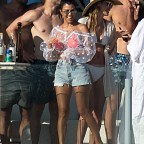 Kourtney Kardashian has fun at a pool bar in Mexico. Kourtney was laughing and joking with a group of people at a private members only beach club.