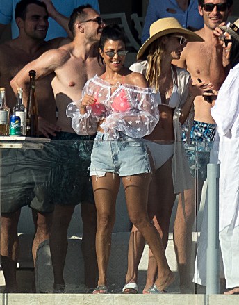 Kourtney Kardashian has fun at a pool bar in Mexico. Kourtney was laughing and joking with a group of people at a private members only beach club. Kourtney and the group were seen taking shots from ice shot glasses, which they threw into the ocean.Pictured: Kourtney KardashianRef: SPL5018470 260818 NON-EXCLUSIVEPicture by: SplashNews.comSplash News and PicturesLos Angeles: 310-821-2666New York: 212-619-2666London: 0207 644 7656Milan: +39 02 4399 8577Sydney: +61 02 9240 7700photodesk@splashnews.comWorld Rights