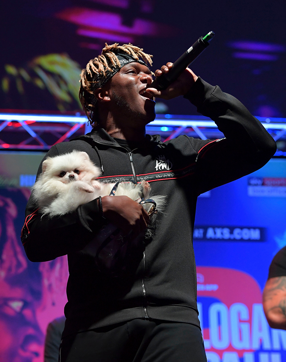 KSI walks on stage with his dog
KSI v Logan Paul 2, UK press conference, Boxing, The Troxy, London, UK - 07 Oct 2019