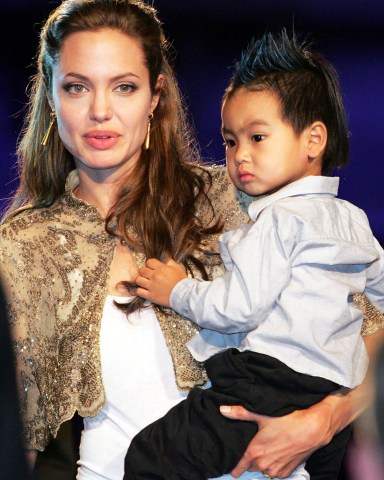 From Sept. 10, 2004. A paparazzo was arrested after he was discovered hiding in bushes outside a daycare center attended by Jolie's adopted son, authorities said. Photographer Clint Brewer, 25, was trying to take pictures of 4-year-old Maddox Jolie-Pitt, according to Cindy Guagenti, a publicist for Jolie's partner, Brad Pitt
PEOPLE MADDOX JOLIE-PITT, VENICE, Italy