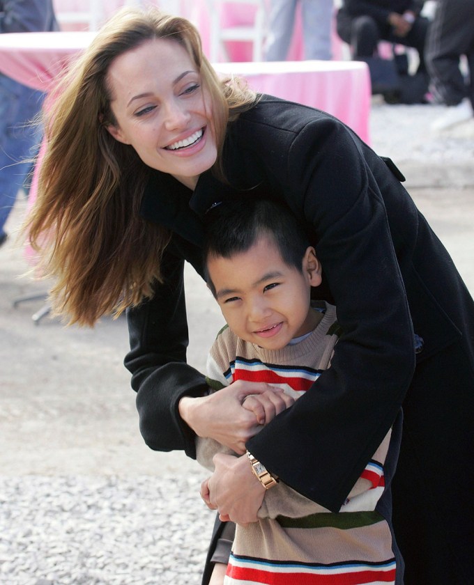 Angelina Jolie snuggles Maddox in New Orleans