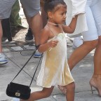 Kim Kardashian and stylish North West with a "Fendi" bag head to the "Cipriani" restaurant in SoHo, NYC