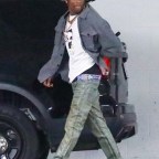*EXCLUSIVE* Travis Scott leaves Super Bowl afterparty at 4 in the morning while Kylie is presumed to be home with the couple's 2 kids