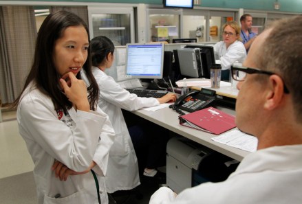 Leana Wen, of Boston, left, who is doing her medical residency in emergency medicine at Harvard-affiliated Brigham and Women's Hospital and Massachusetts General Hospital, speaks with Josh Kosowsky, clinical director of emergency medicine, right, in the emergency department at Brigham and Women's Hospital, in Boston. Wen chose emergency medicine because the hours are more flexible than those of primary care physicians
Not Dr Welby, Boston, USA