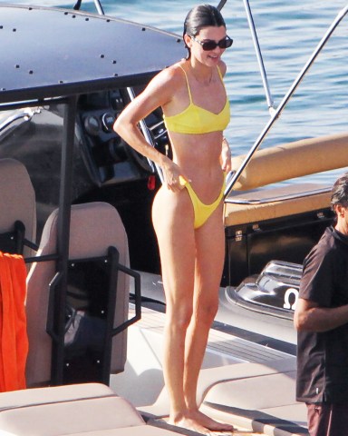 Kendall Jenner in yellow bikini sighted on a speed boat to have fun with friends on Mykonos Island, Greece. 08 Jul 2019 Pictured: Kendall Jenner. Photo credit: Savio / MEGA TheMegaAgency.com +1 888 505 6342 (Mega Agency TagID: MEGA461639_021.jpg) [Photo via Mega Agency]