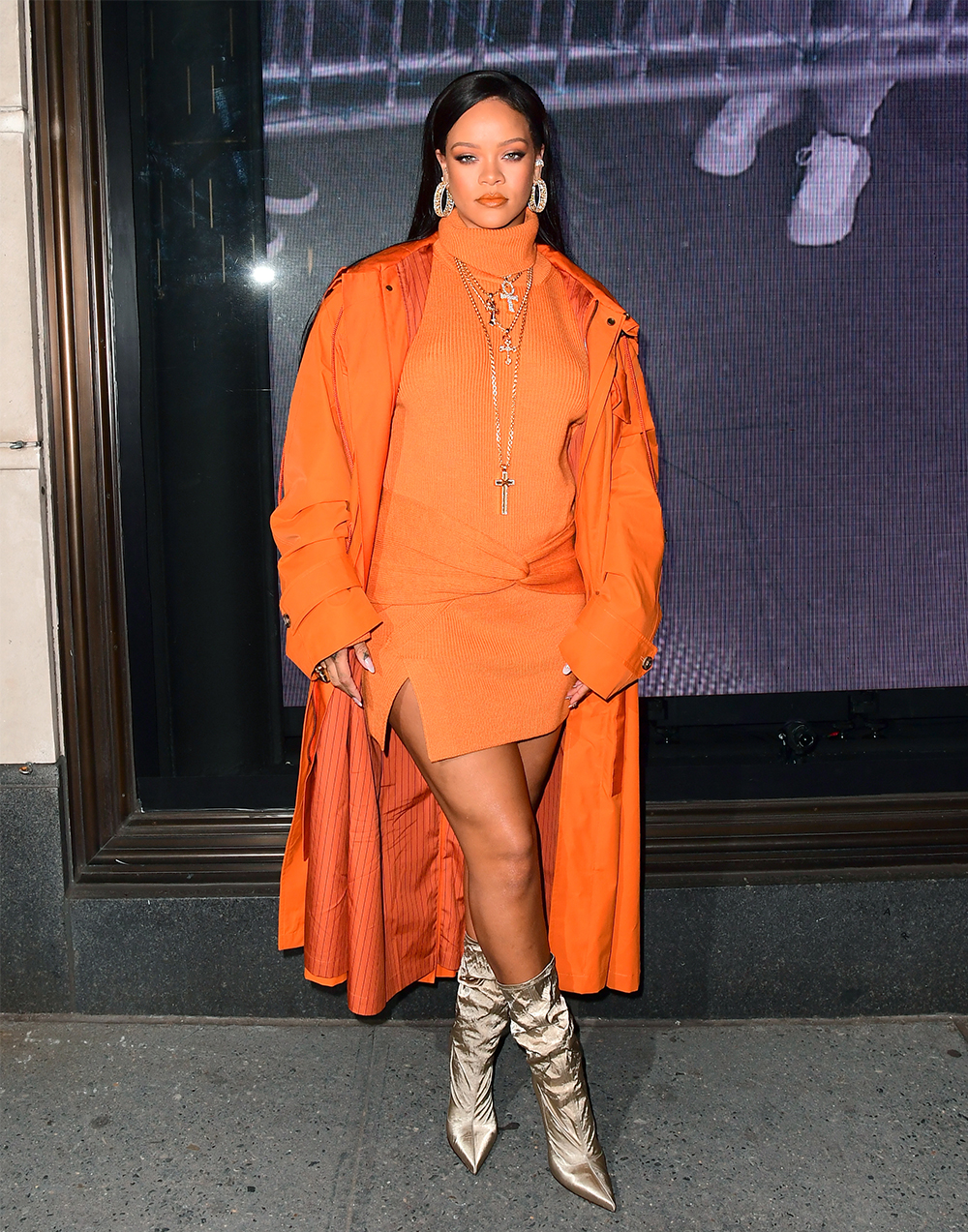 Rihanna Stuns In Orange As She Celebrates Her Fenty Pop Up Shop At Bergdorf Goodman In NYC