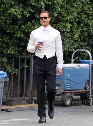 Los Angeles, CA  - *EXCLUSIVE*  - Brad Pitt filming sips on a coffee as he get back to work on his latest film "Babylon".  Brad looked dapper in a tuxedo outfit for today's scenes. Pitt stepped out briefly while filming an interior party scene for which he was dressed to the nines.Pictured: Brad PittBACKGRID USA 28 SEPTEMBER 2021 USA: +1 310 798 9111 / usasales@backgrid.comUK: +44 208 344 2007 / uksales@backgrid.com*UK Clients - Pictures Containing ChildrenPlease Pixelate Face Prior To Publication*