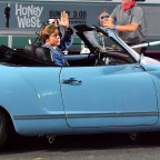 Brad Pitt is all smiles and waves at onlookers while filming 'Once upon a time in Hollywood' on Hollywood Blvd in Los Angeles, CA.