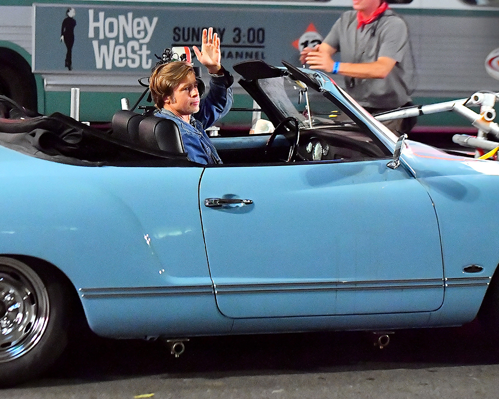 Brad Pitt is all smiles and waves at onlookers while filming 'Once upon a time in Hollywood' on Hollywood Blvd in Los Angeles, CA.