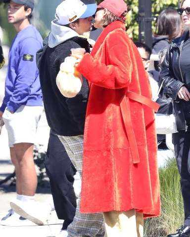 West Hollywood, CA  - *EXCLUSIVE*  - Happy couple Justin Bieber and wife Hailey Bieber hold hands as they exit the Great White after a romantic brunch date in West Hollywood.  Pictured: Justin Bieber and Hailey Bieber  BACKGRID USA 26 MARCH 2023   USA: +1 310 798 9111 / usasales@backgrid.com  UK: +44 208 344 2007 / uksales@backgrid.com  *UK Clients - Pictures Containing Children Please Pixelate Face Prior To Publication*